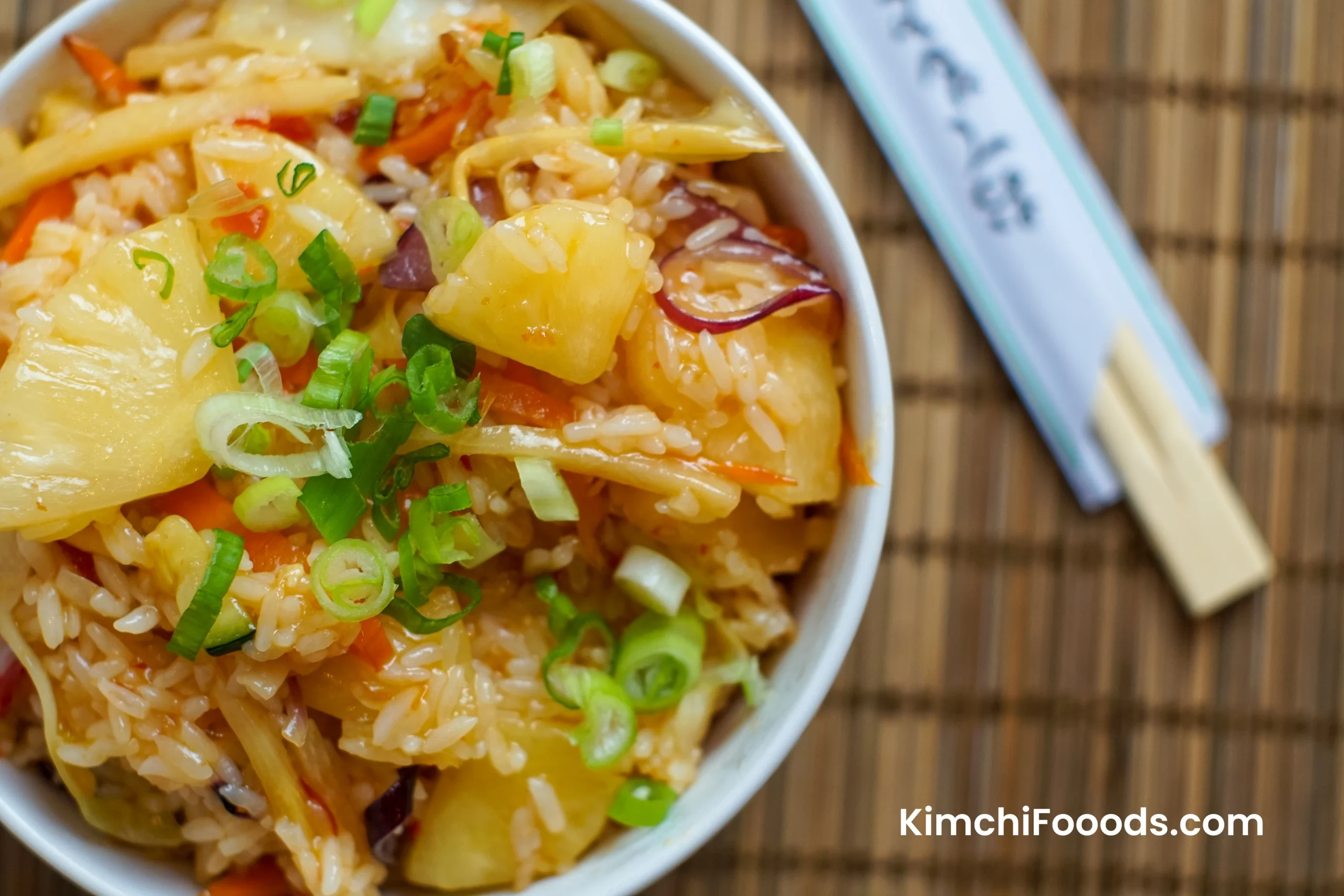 kimchi fried rice placed on a wooden table in a bowle