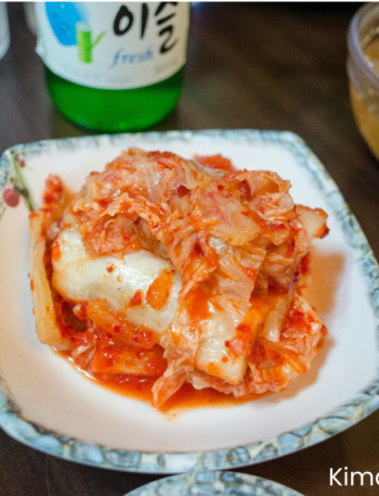 vegan kimchi in a bowl placing on wooden table